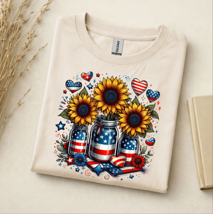 Folded t-shirt with sunflower design featuring American flags